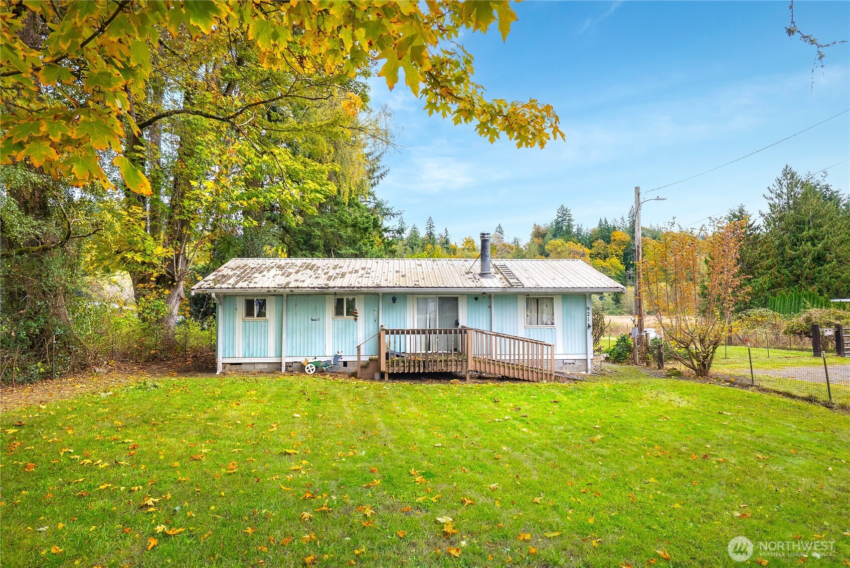 921 Russell Road Snohomish, WA 98290 - Photo 5 of 15 a view of a house with a big yard and large trees