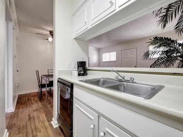 a kitchen with a sink and cabinets