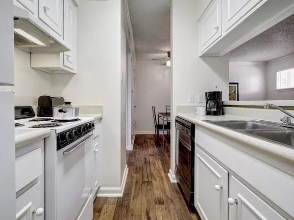 a kitchen with a stove and a sink