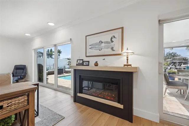 a kitchen with stainless steel appliances granite countertop a stove a sink a refrigerator a center island and a cabinets