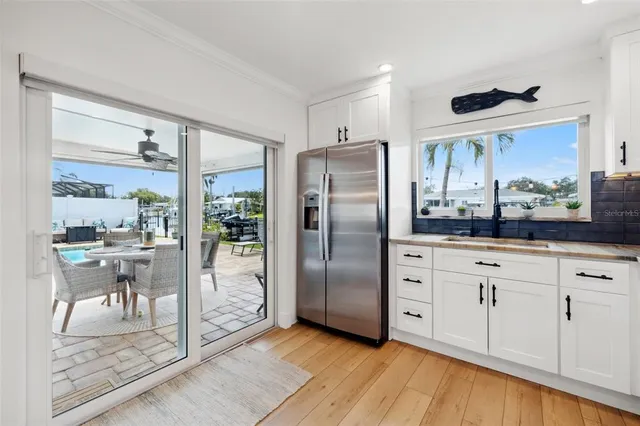a dining room with furniture a chandelier and a rug