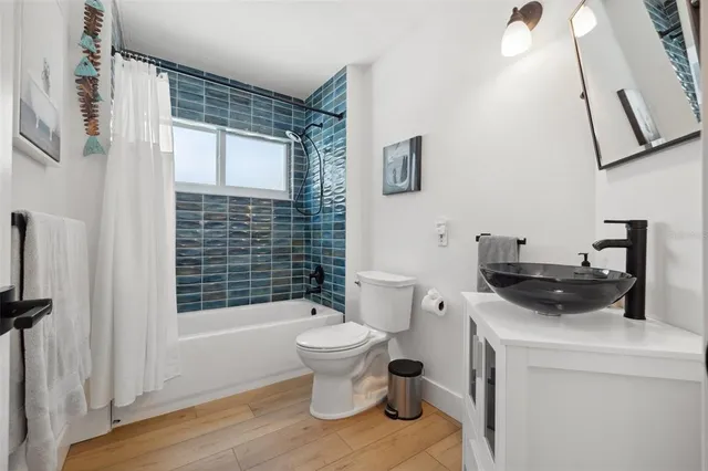 a view of a patio with couches chairs and potted plants