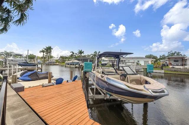a view of swimming pool with outdoor seating