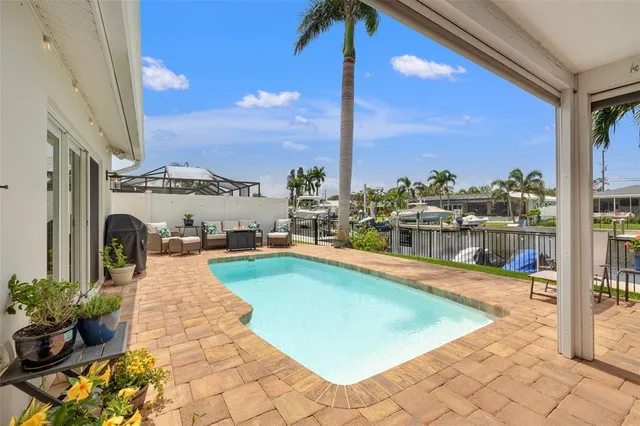 a dining room with furniture and a floor to ceiling window