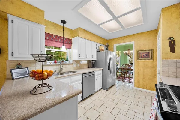 a kitchen with a sink and wooden cabinets