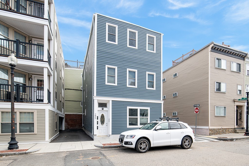 295 D Street, Unit 1 Boston, MA 02127 - Photo 1 of 13 a car parked in front of a building