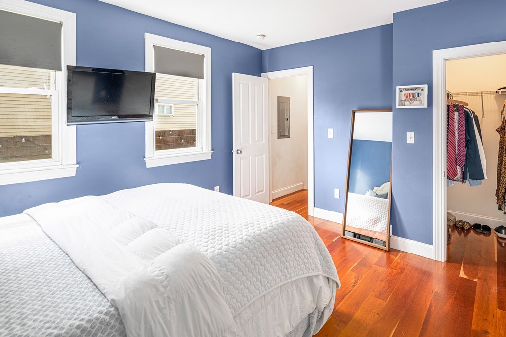 295 D Street, Unit 1 Boston, MA 02127 - Photo 11 of 13 a bedroom with a bed and a flat screen tv