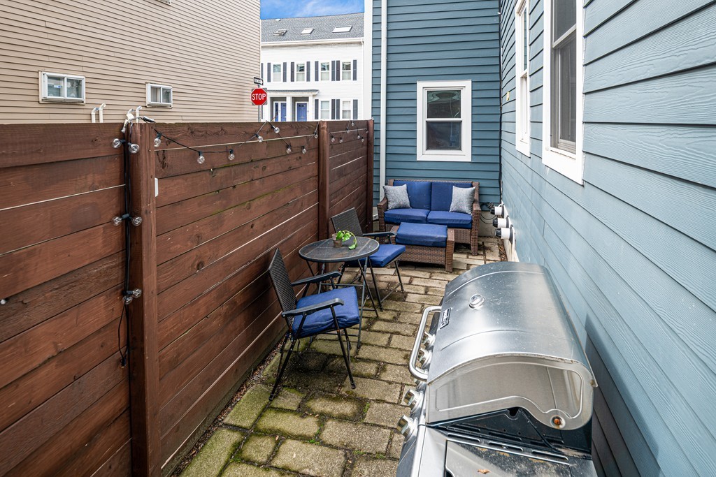 295 D Street, Unit 1 Boston, MA 02127 - Photo 12 of 13 a balcony with table and chairs