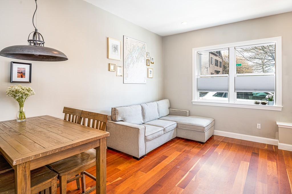 295 D Street, Unit 1 Boston, MA 02127 - Photo 6 of 13 a living room with furniture and a table