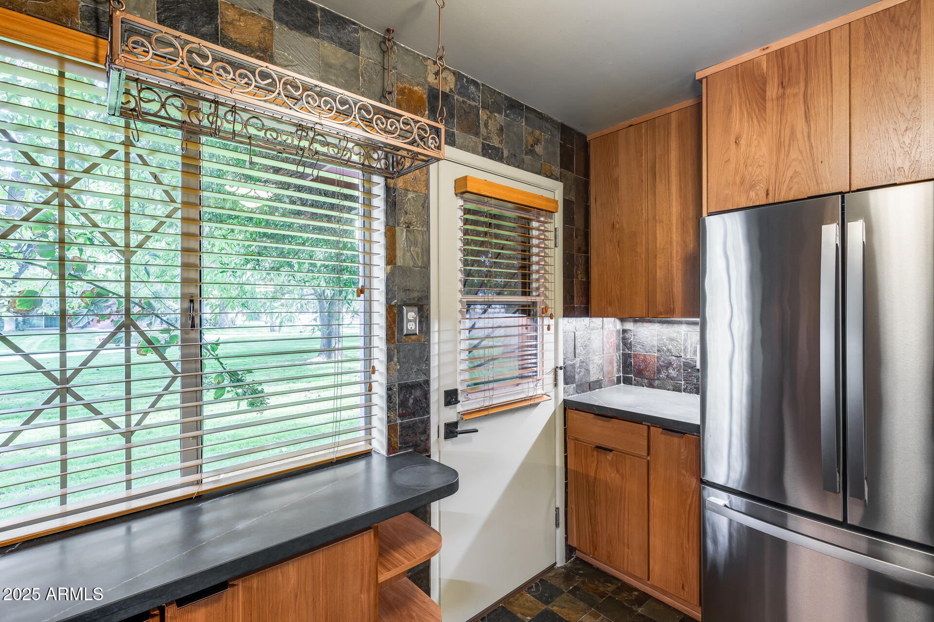 146 East Coronado Road, Unit 40 Phoenix, AZ 85004 - Photo 16 of 39 a kitchen with stainless steel appliances granite countertop a refrigerator and a sink