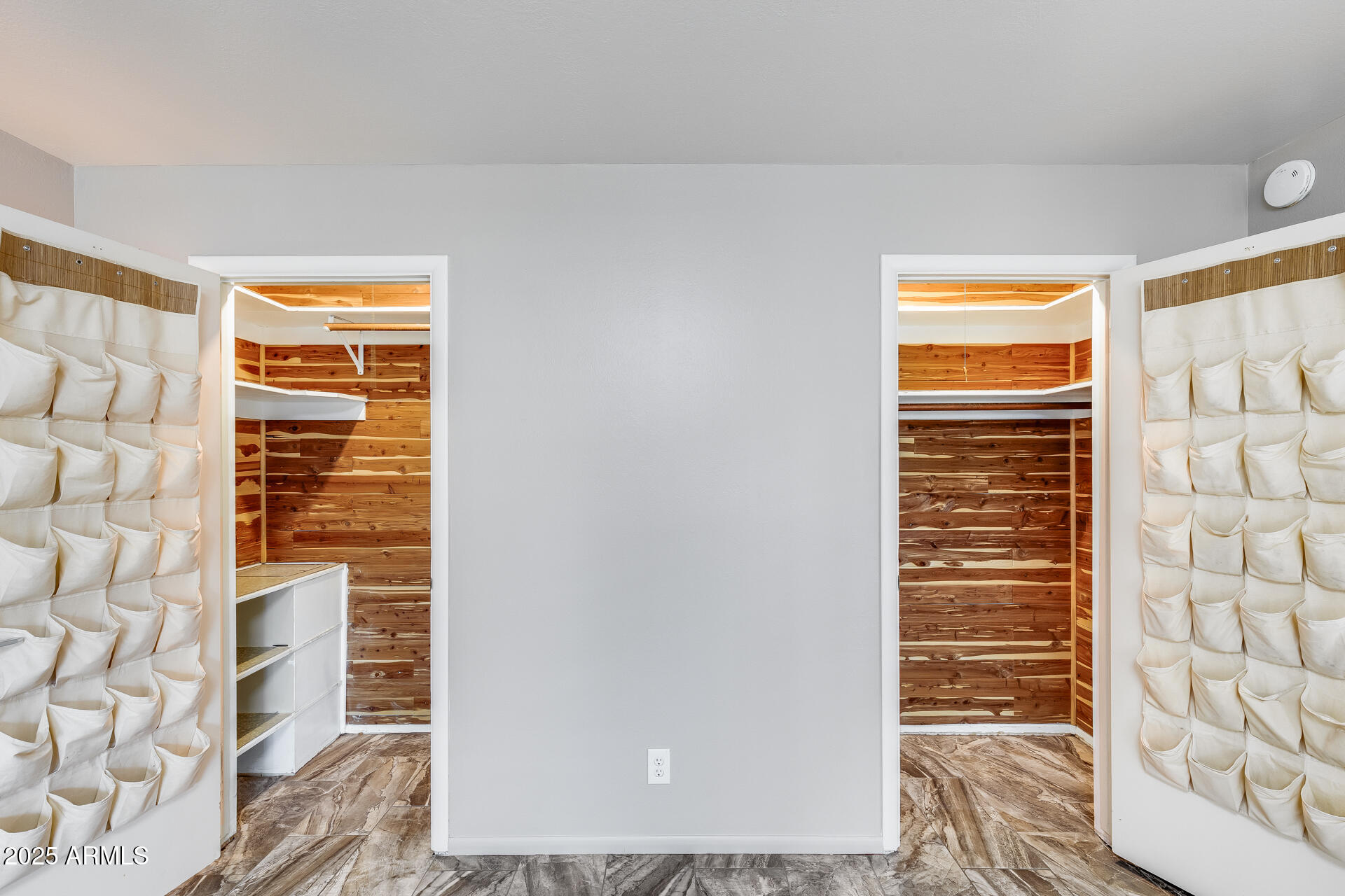 146 East Coronado Road, Unit 40 Phoenix, AZ 85004 - Photo 25 of 39 a view of walk in closet with clothes and shoes