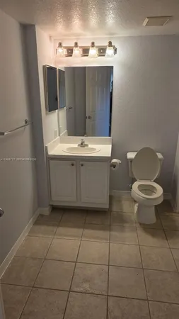 a bathroom with a bathtub and a toilet