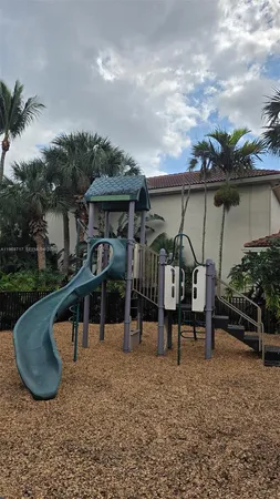 a view of a park with palm trees