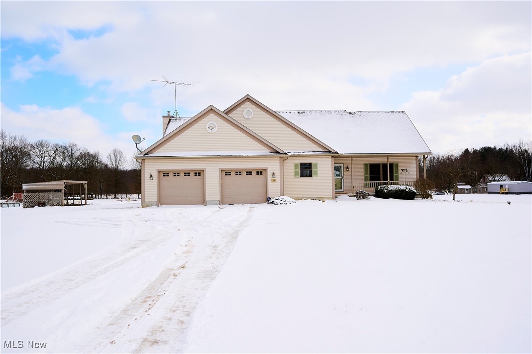 706 Watson Road Deerfield, OH 44411 - Photo 1 of 36 Ranch-style home with a garage