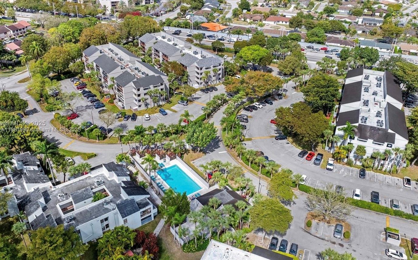 8811 Southwest 132nd Place, Unit 401CW Miami, FL 33186 - Photo 10 of 10 an aerial view of residential houses with outdoor space