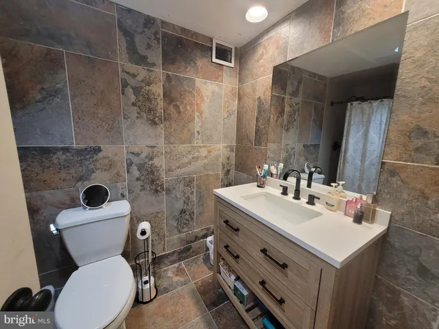 a bathroom with a toilet and shower