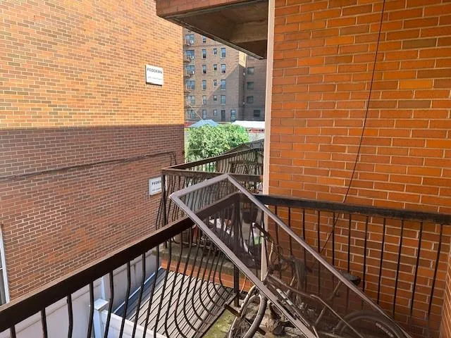 a view of balcony with wooden floor