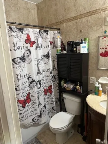 a bathroom with a toilet and a sink