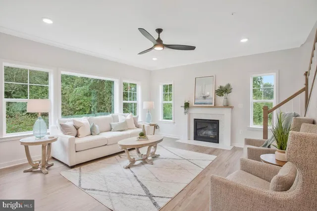 a view of a dining room with furniture and a chandelier