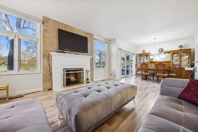 a spacious bedroom with a large bed and a fireplace