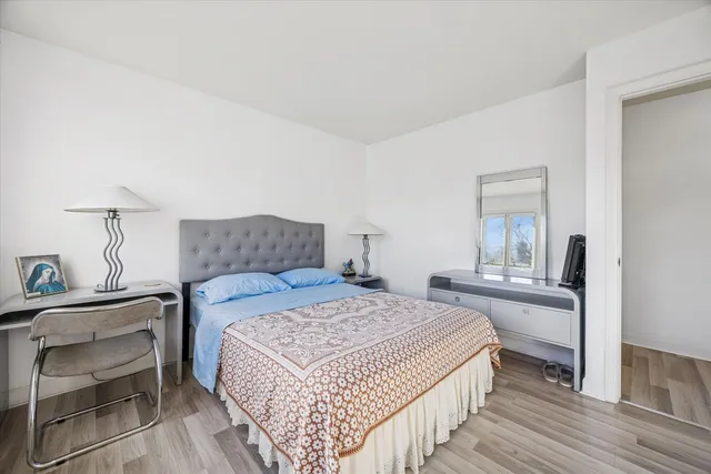 a bedroom with a bed and a table