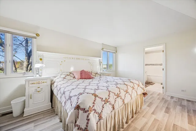 a bedroom with a bed and a dresser