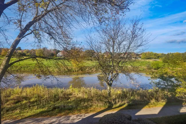 a bathroom with a sink mirror vanity and toilet