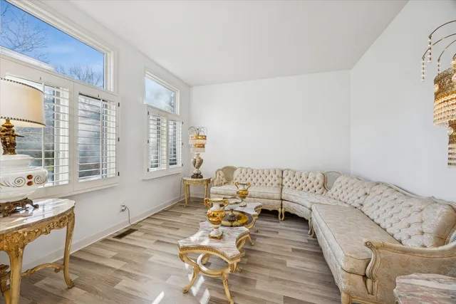 a bedroom with furniture and a window