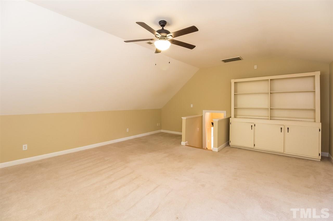 8425 Summersprings Lane Raleigh, NC 27615 - Photo 18 of 25 Bookcase can be removed, wall plumbed for wetbar