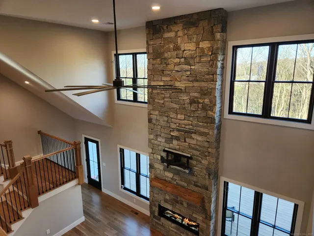 a view of entryway with stairs and wooden floor