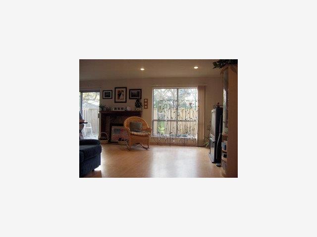 812 Rigel Lane Foster City, CA 94404 - Photo 4 of 5 a living room with furniture and a large window