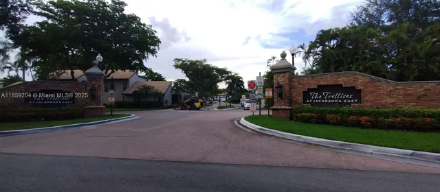 a sign board with a small yard