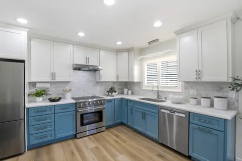 a kitchen with lots of counter top space and dining table