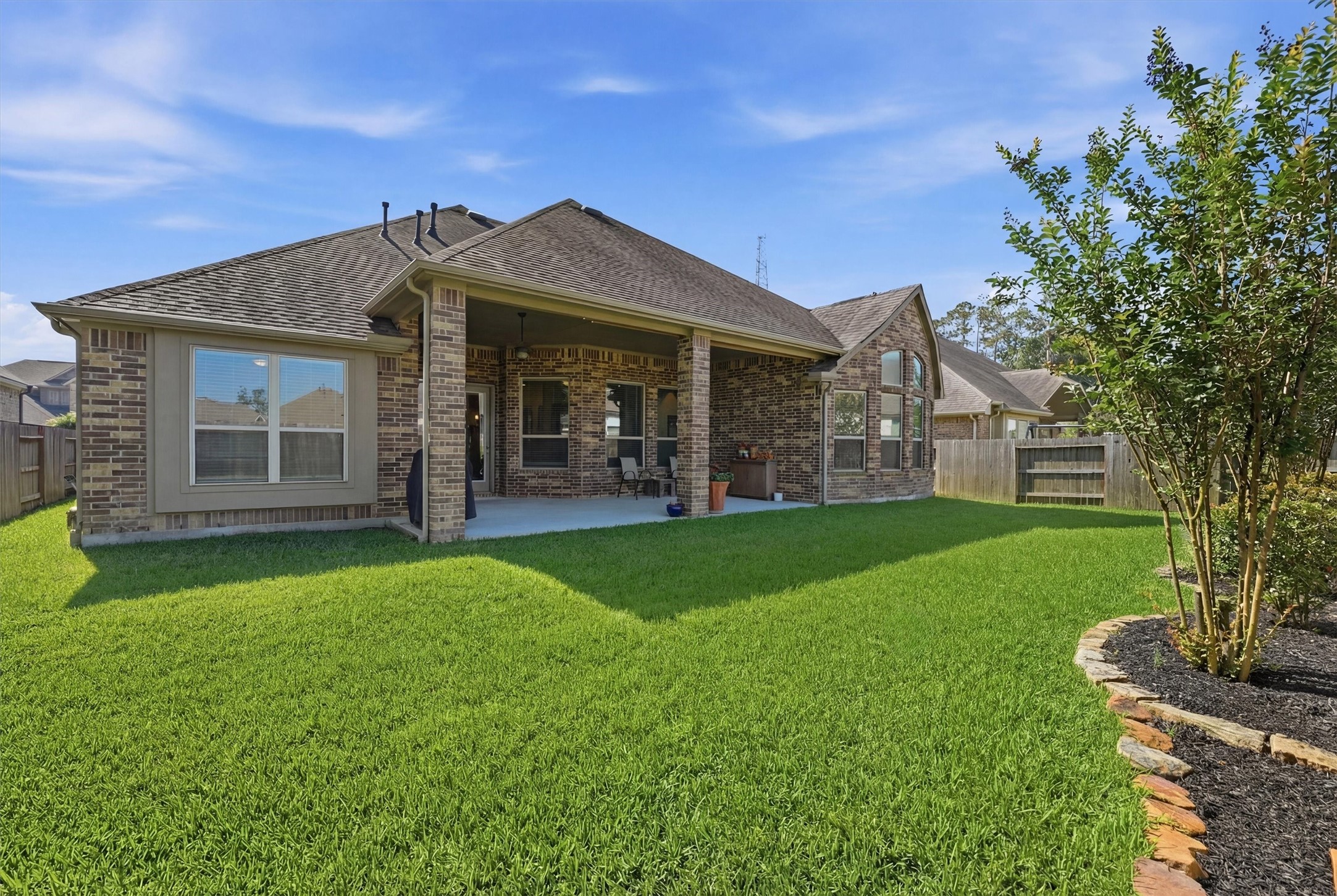 9307 Providence Bend Lane Houston, TX 77365 - Photo 35 of 45 Large covered patio with a pool sized yard