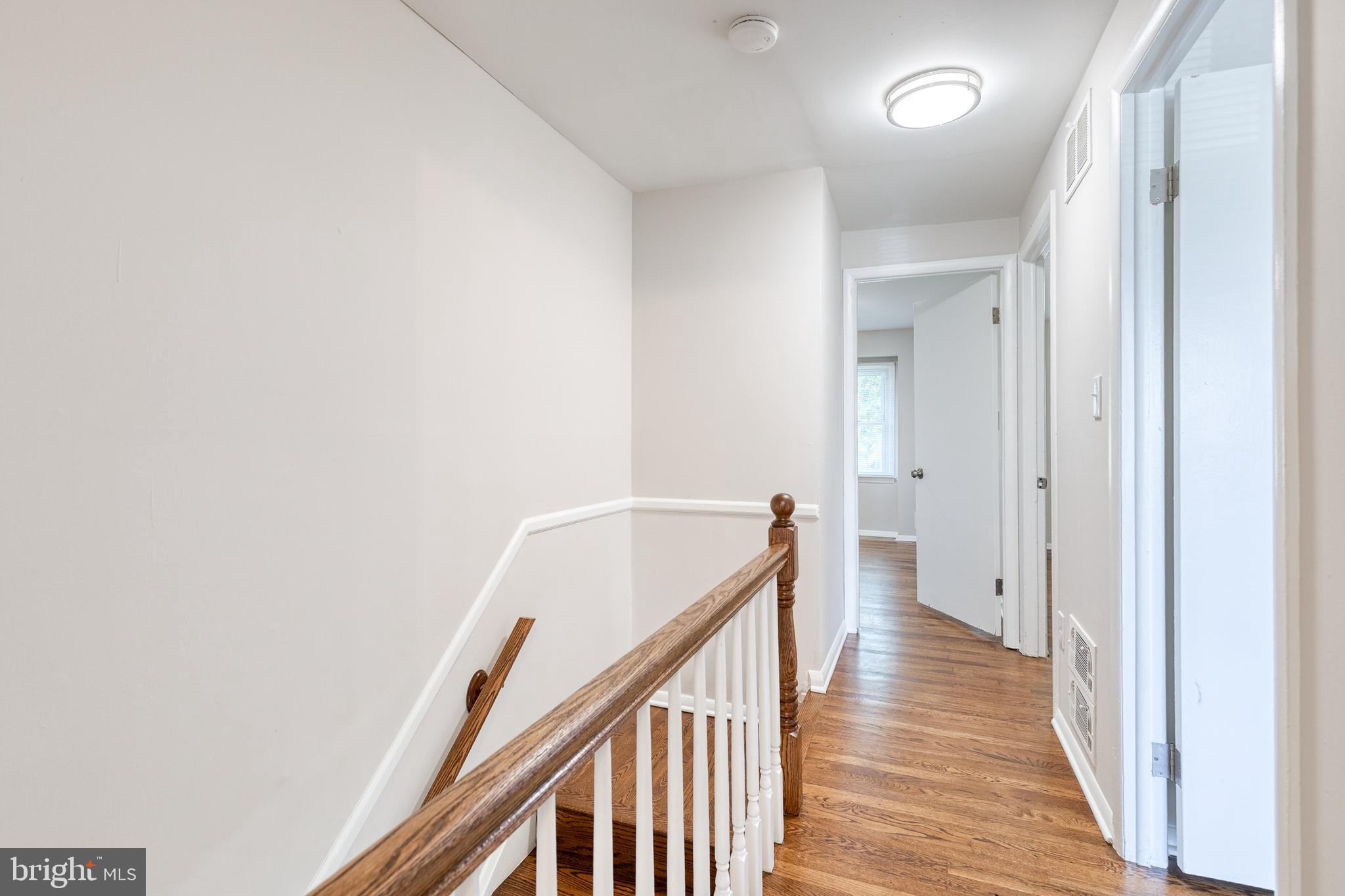 5649 Utrecht Road Baltimore, MD 21206 - Photo 32 of 42 a view of a hallway with wooden floor