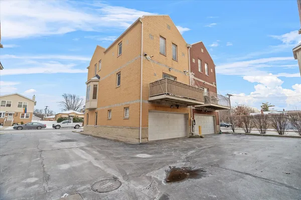 a view of a building with car parked
