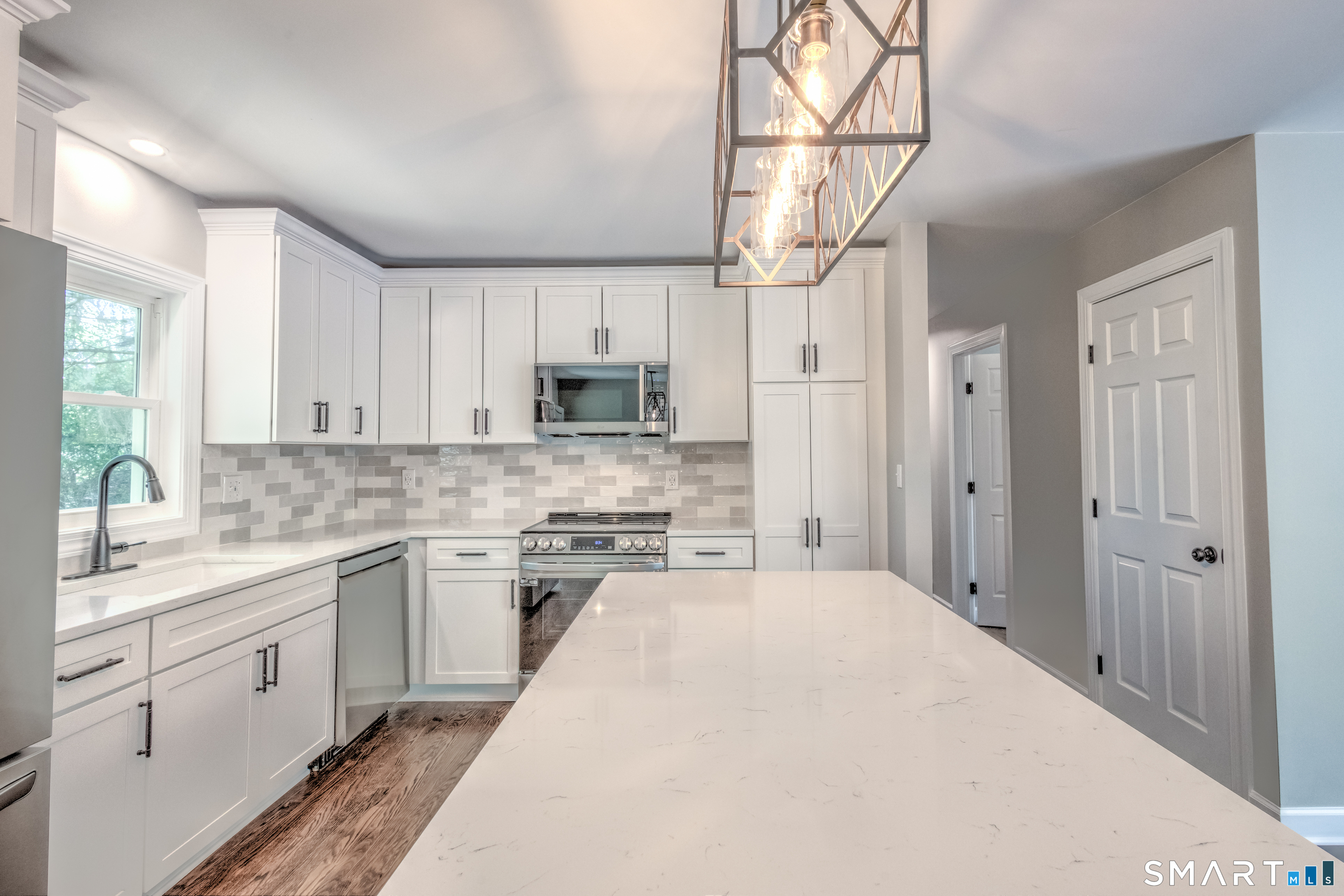 437 Middle Rd Turnpike Woodbury, CT 06798 - Photo 3 of 17 a kitchen with a sink a stove and cabinets