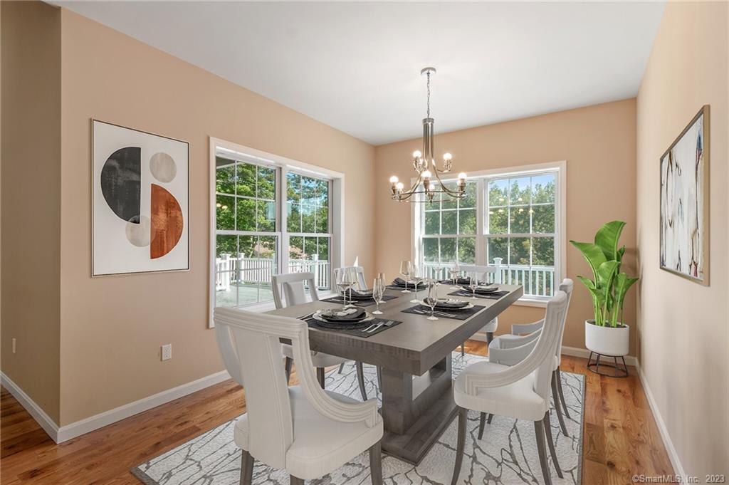18 A Talcott Ridge Drive Middletown, CT 06457 - Photo 13 of 32 a dining room with furniture a chandelier and wooden floor