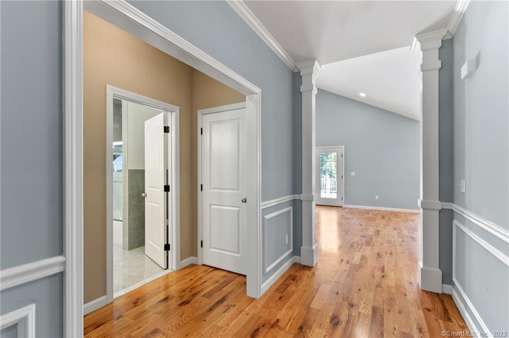 18 A Talcott Ridge Drive Middletown, CT 06457 - Photo 18 of 32 a view of a hallway with wooden floor and staircase