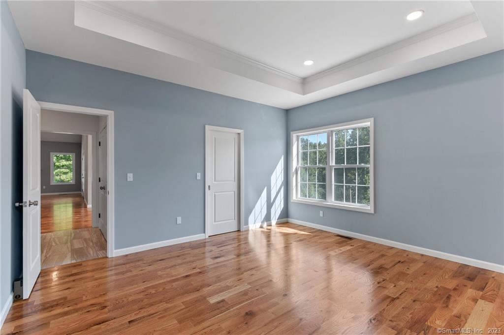 18 A Talcott Ridge Drive Middletown, CT 06457 - Photo 22 of 32 a view of an empty room with wooden floor and a window