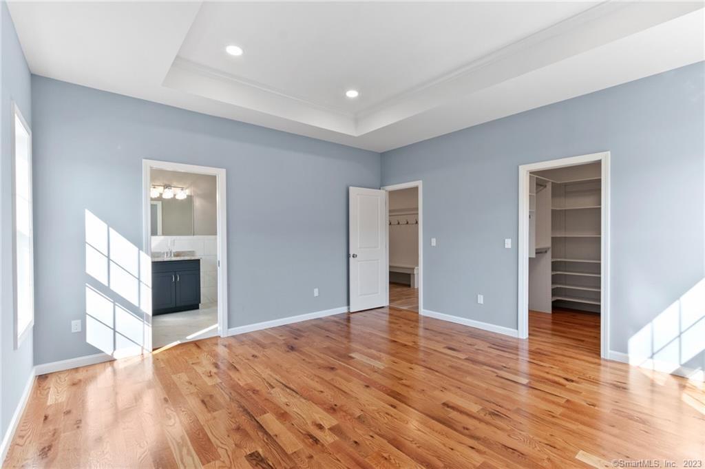 18 A Talcott Ridge Drive Middletown, CT 06457 - Photo 23 of 32 a view of a livingroom with wooden floor and staircase