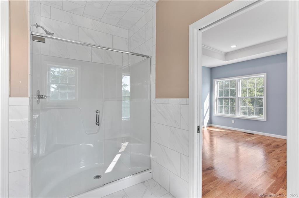 18 A Talcott Ridge Drive Middletown, CT 06457 - Photo 26 of 32 a bathroom with a shower and a tub