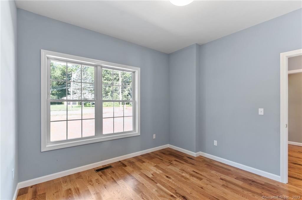 18 A Talcott Ridge Drive Middletown, CT 06457 - Photo 29 of 32 a view of an empty room with wooden floor and a window
