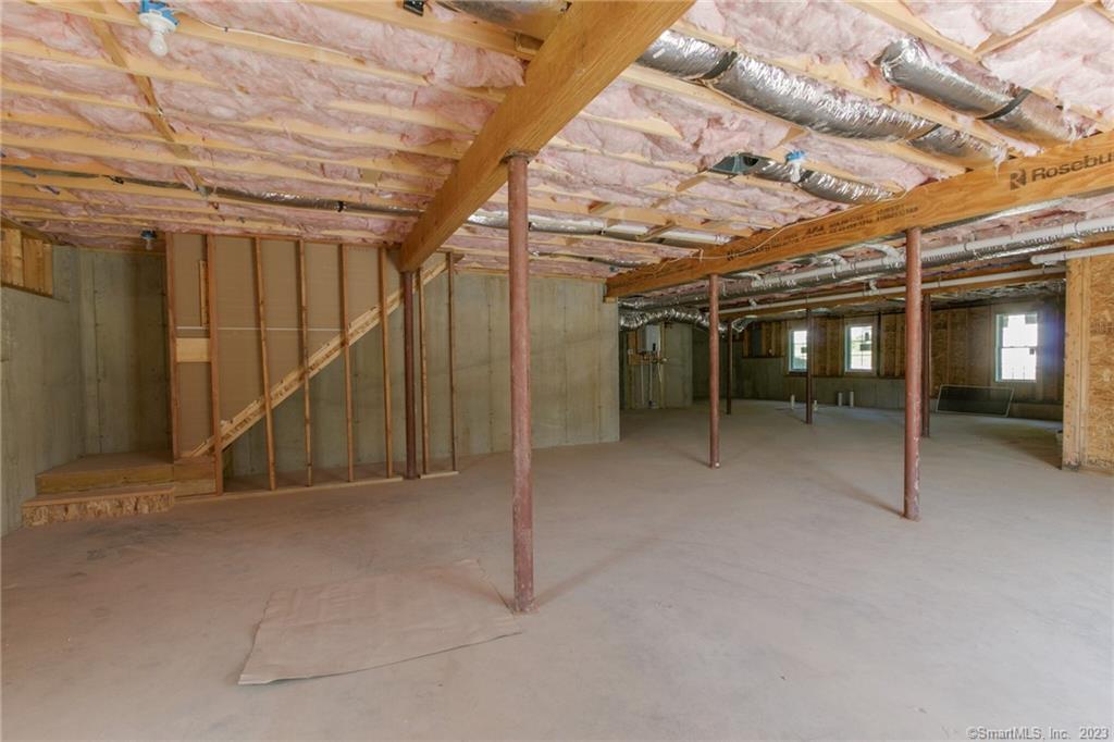18 A Talcott Ridge Drive Middletown, CT 06457 - Photo 31 of 32 a view of empty room with wooden walls