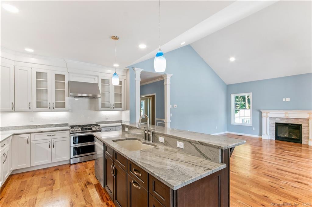 18 A Talcott Ridge Drive Middletown, CT 06457 - Photo 7 of 32 a kitchen with a stove sink and cabinets