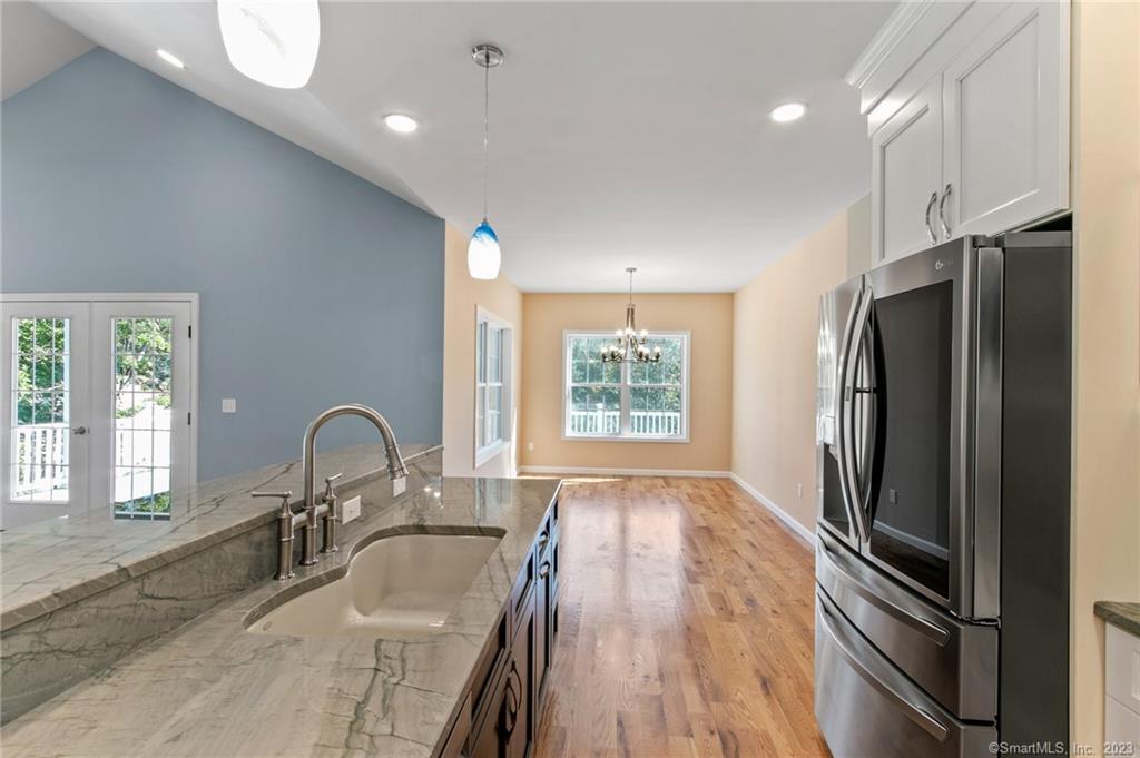 18 A Talcott Ridge Drive Middletown, CT 06457 - Photo 9 of 32 a kitchen with sink refrigerator and window
