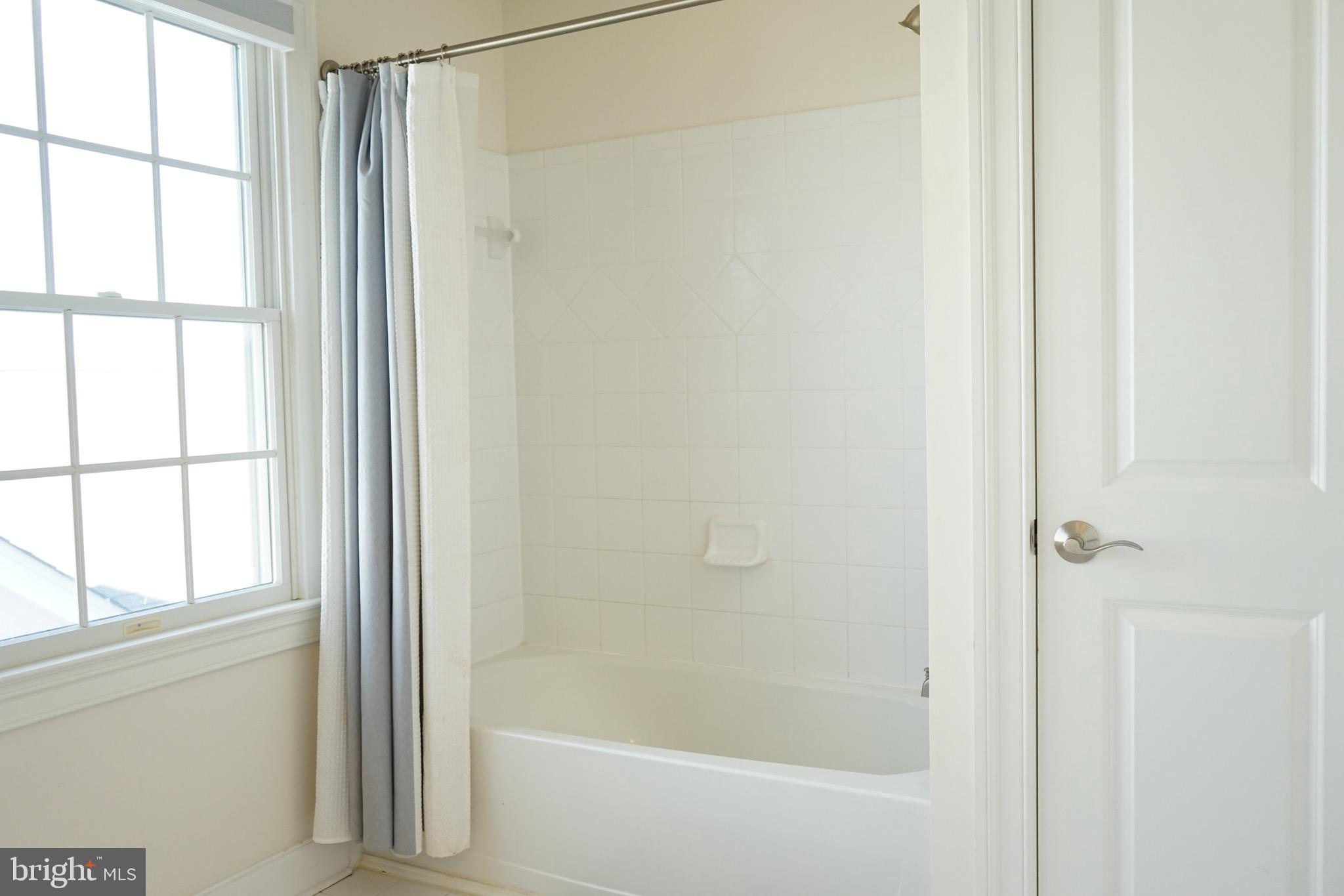 3937 Addison Woods Road Frederick, MD 21704 - Photo 4 of 13 a bathroom with a bathtub