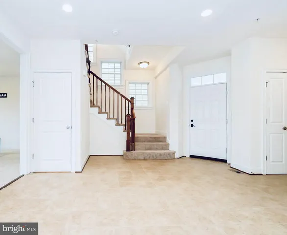 a view of an empty room with stairs