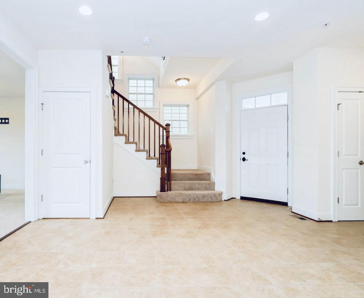3937 Addison Woods Road Frederick, MD 21704 - Photo 7 of 13 a view of an empty room with stairs