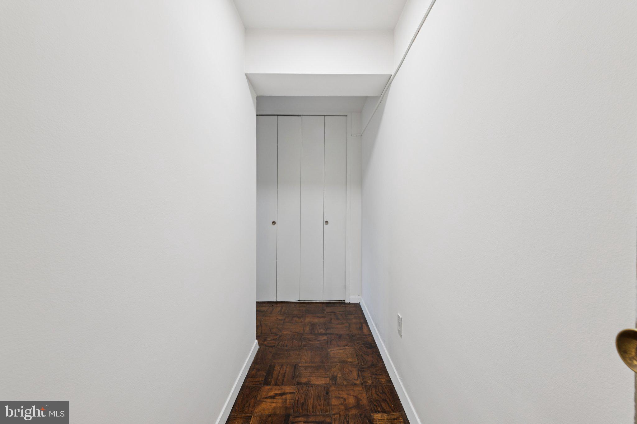 5410 Connecticut Avenue Northwest, Unit 315 Washington, DC 20015 - Photo 12 of 22 a view of a hallway with wooden floor